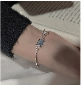 Close-up of S925 sterling silver bead bracelet featuring a square aquamarine gemstone