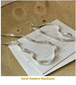 Detail of S925 sterling silver twisted link necklace with textured finish and lobster clasp