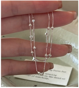 Detailed close-up of S925 sterling silver box chain with geometric rhombus beads
