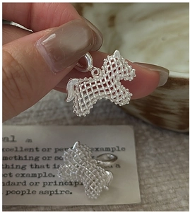 Detail view of a hollow mesh S925 sterling silver horse pendant with a vintage texture