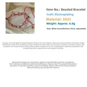 Detail of S925 sterling silver beads on a braided red and white adjustable cord bracelet