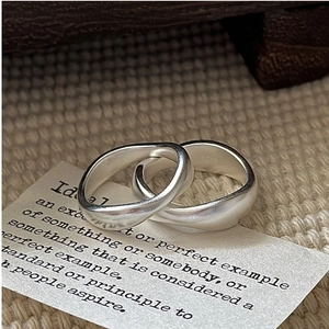 Macro shot of S925 sterling silver interlocking rings with a matte frosted texture