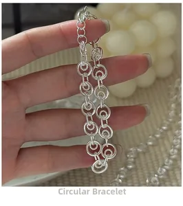 Detailed view of S925 sterling silver circle link bracelet with dual ring design