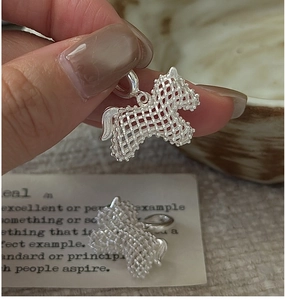Detail of hollow woven texture on S925 sterling silver pony pendants with artisan finish