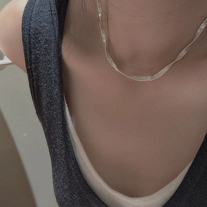 Minimalist S925 sterling silver flat herringbone chain necklace on a female model