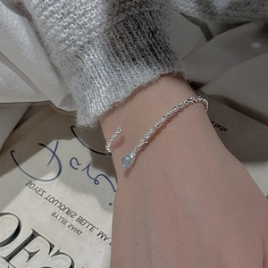 Minimalist S925 sterling silver twist cuff bracelet with light blue gemstone detail