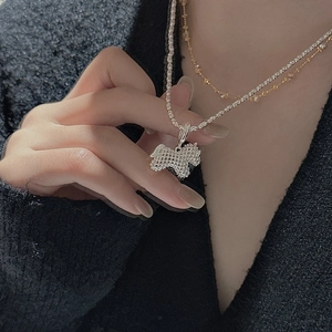 S925 sterling silver necklace featuring a hollow woven puppy pendant in a layered style