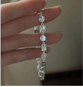 Detailed view of S925 sterling silver bracelet with textured discs and matte finish