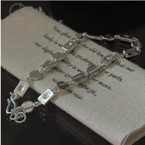 Detail view of vintage S925 silver bracelet with irregular textured geometric plates