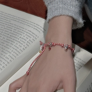 Handmade S925 sterling silver woven rope bracelet with heart charms on model