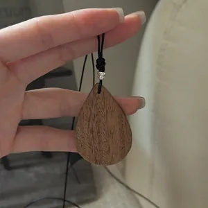 Minimalist S925 silver wood grain teardrop pendant necklace with black cord strap
