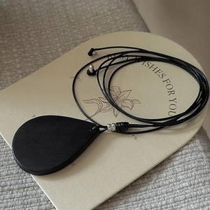 Minimalist S925 silver sweater chain with matte black wood texture teardrop pendant