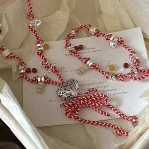 S925 sterling silver red and white woven bracelet with a hollow heart charm pendant