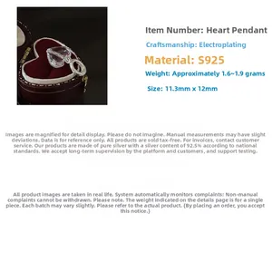 Macro shot of S925 sterling silver heart crystal pendant in a velvet jewelry box