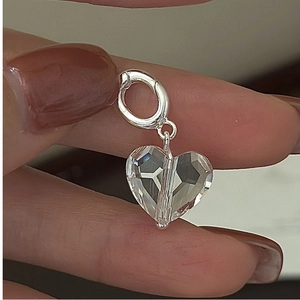 Macro shot of a faceted heart crystal pendant with silver spring clasp for DIY jewelry