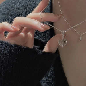 S925 sterling silver necklace with faceted crystal heart pendant worn by model
