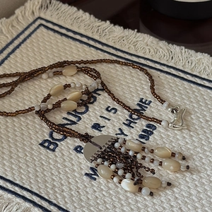 Retro 925 silver bohemian beaded necklace with brown seeds and shell tassel pendant