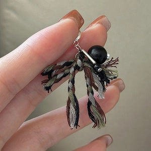 Handcrafted S925 sterling silver tassel pendant with woven ropes and black bead