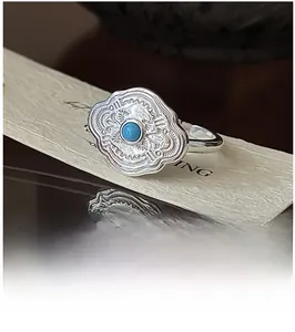 Macro detail of retro S925 silver ring featuring vintage turquoise and cloud texture