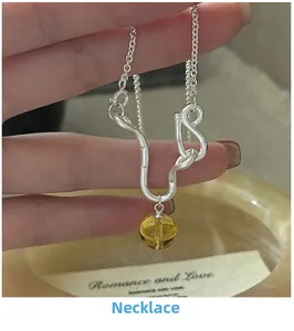 Macro view of S925 sterling silver necklace with irregular wave pendant and amber crystal