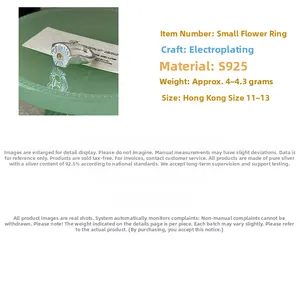 Detail view of S925 silver daisy ring with gold plating and engraved size specifications
