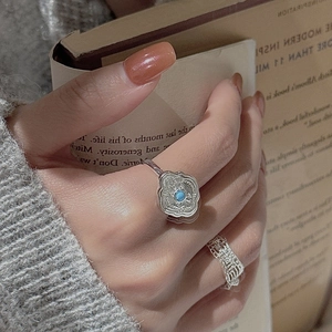 S925 sterling silver ring set featuring retro turquoise stone on an open book background