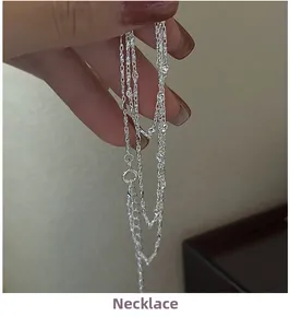 Close-up of S925 sterling silver chain with geometric beads and heart charm clasp
