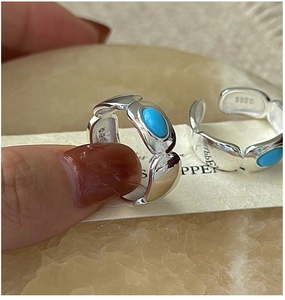 Detailed macro view showing the S925 sterling silver hallmark on the turquoise ring