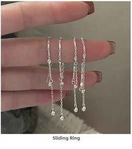 Close-up of adjustable S925 sterling silver chain rings with polished bead charms