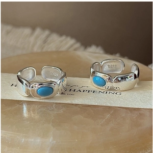 Detail of S925 sterling silver ring featuring a blue turquoise stone and adjustable band