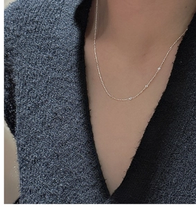 Detail of S925 sterling silver necklace with sparkling small cubic zirconia stones