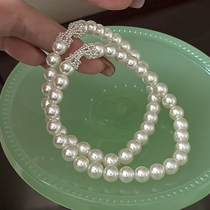 Bracelet élégant en perles d'argent S925 orné de délicats nœuds en argent raffinés