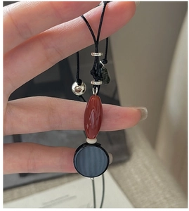 Detail of S925 silver retro necklace featuring black agate and handmade braided cord