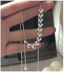 Macro detail of S925 sterling silver wheat leaf Y-necklace with adjustable sliding clasp