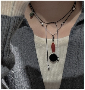 Double-layered S925 silver necklace with retro agate pendant on gray sweater
