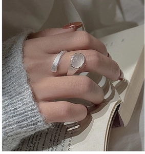 Detailed view of an adjustable S925 silver ring featuring an oval moonstone on a brushed band