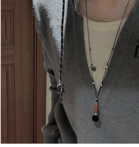 Retro s925 silver sweater necklace with agate pendant styled on a gray hoodie model