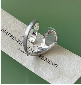 Macro view of S925 sterling silver ring detail showing the hallmark and brushed texture