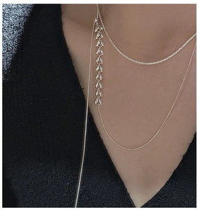 Detail of silver S925 necklace featuring a double-layered wheat ear pull chain design
