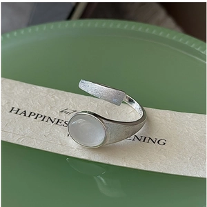 Detail of S925 sterling silver brushed ring with oval gemstone and S925 hallmark