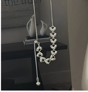 Detail of silver S925 necklace featuring an olive leaf chain and adjustable Y-shape slide