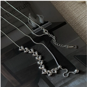Macro detail of S925 sterling silver wheat chain with AG925 hallmark on pull clasp