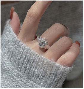 Macro shot of S925 silver ring with hammered texture and oval cubic zirconia stone