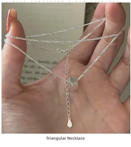 Detailed close-up of S925 sterling silver chain with a polished geometric cube pendant