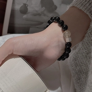 Minimalist S925 silver bracelet with black agate beads and rutilated quartz on wrist