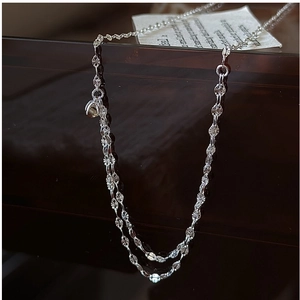 Macro view of S925 sterling silver chain featuring radiant textured circular metal links