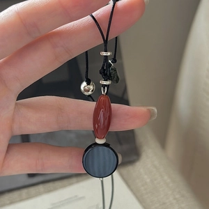 Minimalist S925 sterling silver necklace with red agate beads and black circular pendant