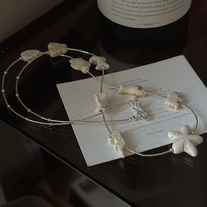 S925 sterling silver long sweater necklace with various white animal and leaf pendants