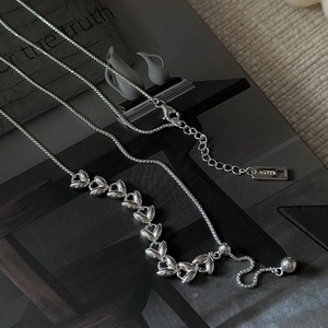 S925 sterling silver wheat-style Y-necklace with adjustable pull chain on magazine background