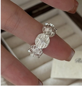 Detail of S925 sterling silver ring featuring starburst engravings and micro-set zircons